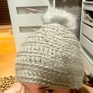 Hand crocheted grey beanie with poof